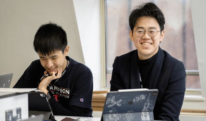 Boy looking at book and smiling